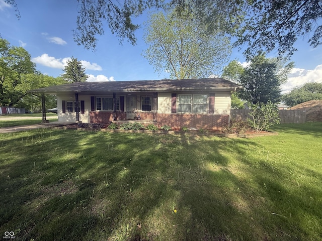 ranch-style house featuring brick siding and covered porch