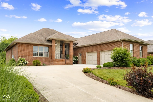 888 Westcreek Dr, Columbus, IN 47201 - single story home featuring brick siding, concrete driveway, a garage, and a shingled roof