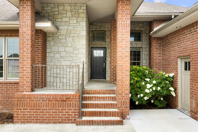 888 Westcreek Dr, Columbus, IN 47201 - entrance to property with roof with shingles, stone siding, and brick siding