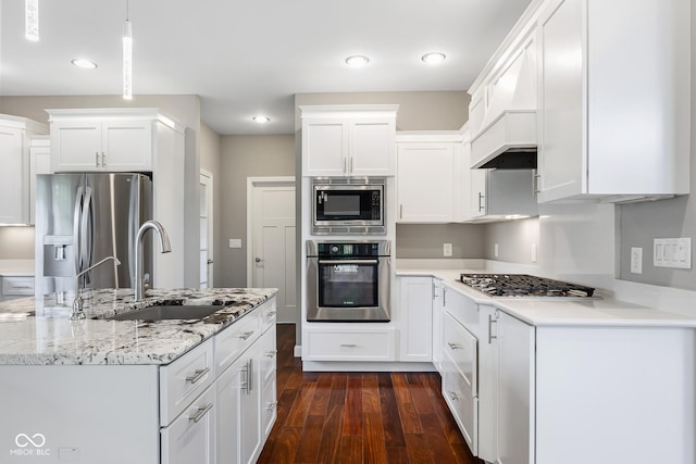 888 Westcreek Dr, Columbus, IN 47201 - kitchen featuring appliances with stainless steel finishes, white cabinets, dark wood finished floors, recessed lighting, and light stone countertops