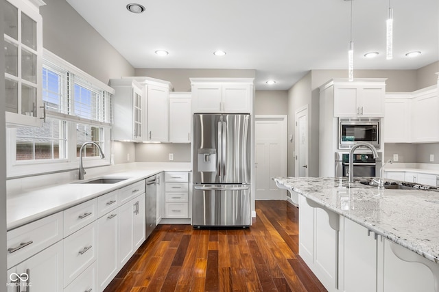 888 Westcreek Dr, Columbus, IN 47201 - kitchen featuring stainless steel appliances, dark wood-type flooring, glass insert cabinets, white cabinetry, and recessed lighting