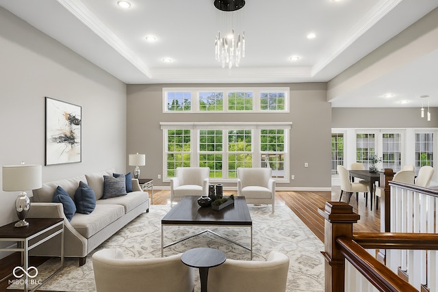 888 Westcreek Dr, Columbus, IN 47201 - living room featuring a chandelier, a tray ceiling, plenty of natural light, light wood-type flooring, and recessed lighting