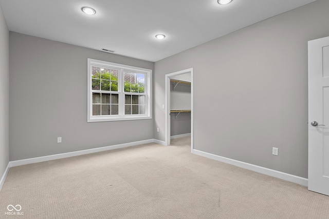 888 Westcreek Dr, Columbus, IN 47201 - unfurnished bedroom with light carpet, a walk in closet, and a closet
