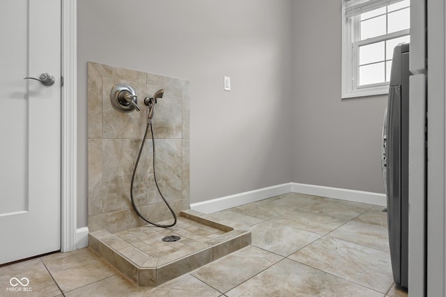 888 Westcreek Dr, Columbus, IN 47201 - full bathroom featuring a tile shower and baseboards