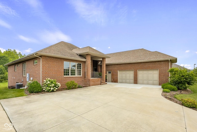 888 Westcreek Dr, Columbus, IN 47201 - ranch-style house with brick siding, driveway, a garage, and a shingled roof
