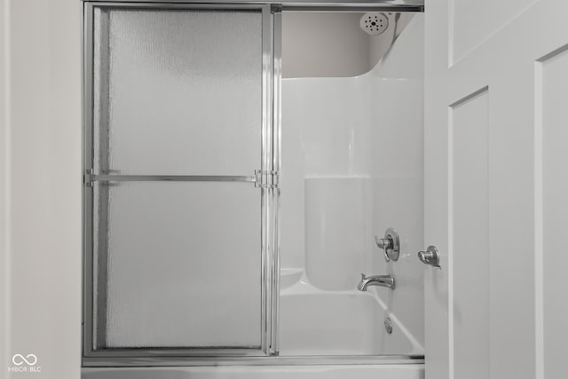 888 Westcreek Dr, Columbus, IN 47201 - bathroom with combined bath / shower with glass door