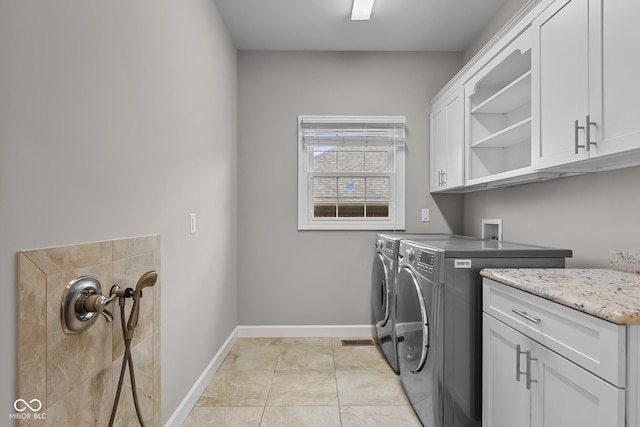 888 Westcreek Dr, Columbus, IN 47201 - laundry area featuring separate washer and dryer and cabinet space