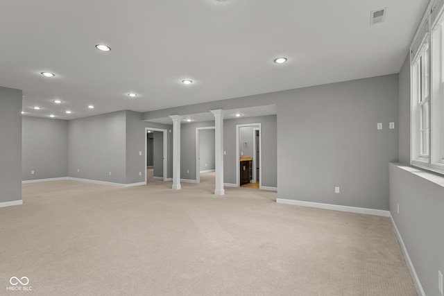 888 Westcreek Dr, Columbus, IN 47201 - empty room featuring light carpet, recessed lighting, and ornate columns