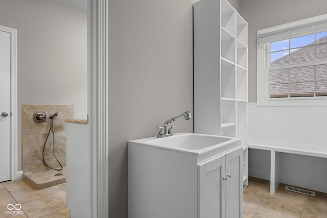 888 Westcreek Dr, Columbus, IN 47201 - bathroom with tiled shower and tile patterned floors