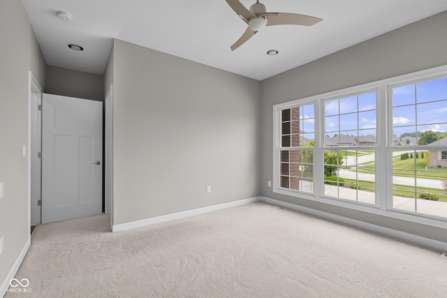 888 Westcreek Dr, Columbus, IN 47201 - unfurnished room featuring light carpet, ceiling fan, and a smoke detector