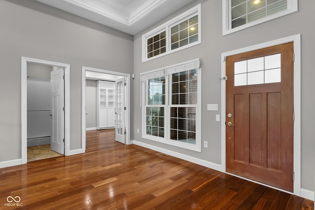 888 Westcreek Dr, Columbus, IN 47201 - foyer featuring a towering ceiling, wood finished floors, plenty of natural light, and crown molding