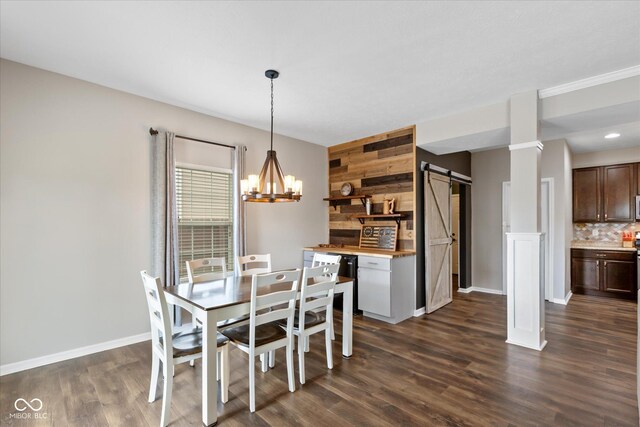 695 Bobtail Dr, Greenfield, IN 46140 - dining room featuring a barn door, a chandelier, baseboards, and dark wood finished floors