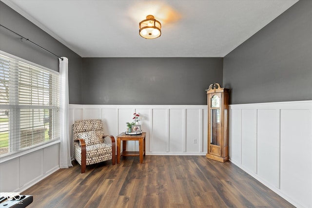 695 Bobtail Dr, Greenfield, IN 46140 - sitting room featuring a decorative wall, dark wood-type flooring, and a wainscoted wall