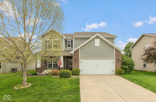 695 Bobtail Dr, Greenfield, IN 46140 - view of front of property featuring brick siding, driveway, and a front yard