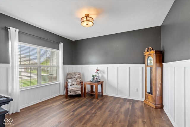 695 Bobtail Dr, Greenfield, IN 46140 - sitting room with a decorative wall, dark wood-type flooring, and wainscoting