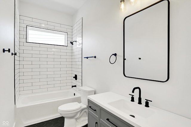 full bath featuring toilet, washtub / shower combination, vanity, and tile patterned flooring