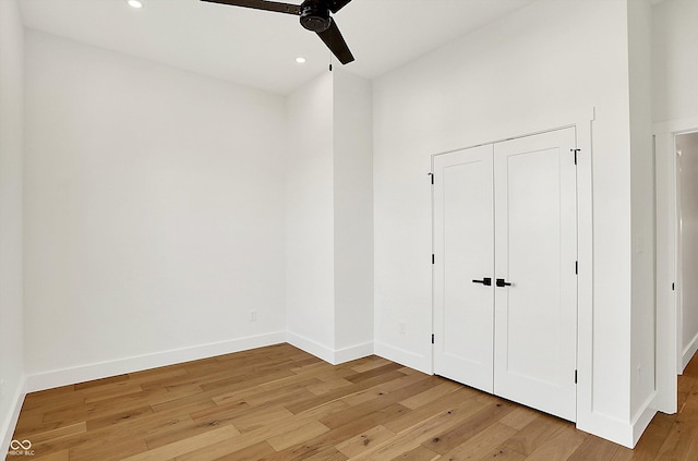 unfurnished bedroom featuring light wood-style floors, baseboards, recessed lighting, and a ceiling fan