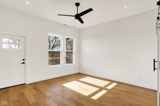 foyer entrance with ceiling fan, light wood-type flooring, baseboards, and recessed lighting