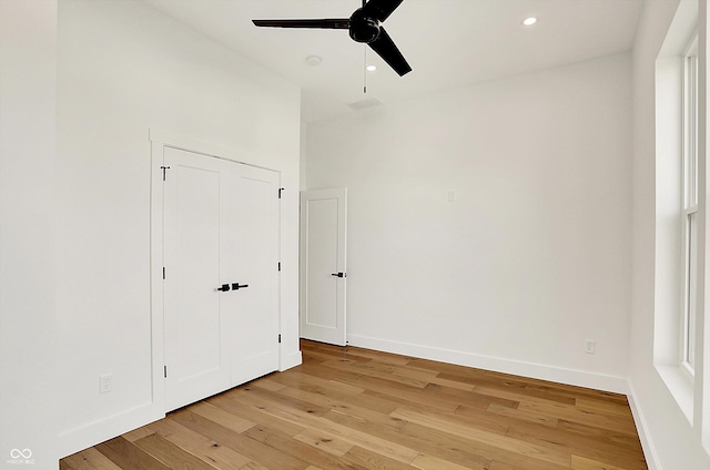 unfurnished bedroom with light wood-type flooring, baseboards, recessed lighting, and ceiling fan