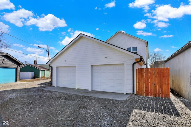 garage with fence