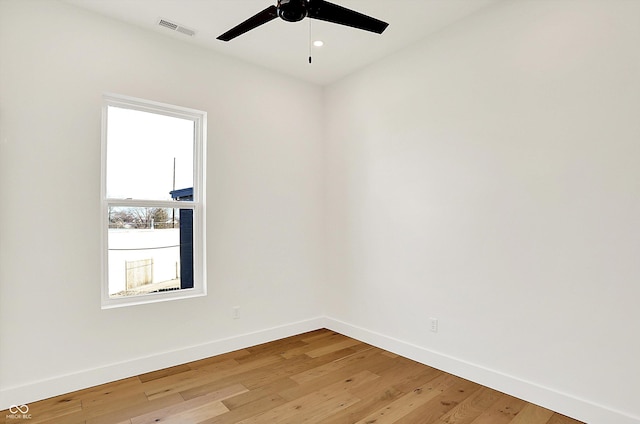 empty room featuring baseboards, a ceiling fan, light wood-style floors, and recessed lighting
