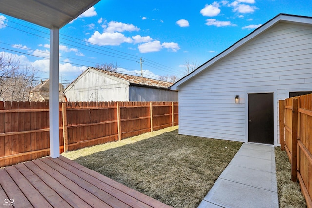fenced backyard featuring a wooden deck