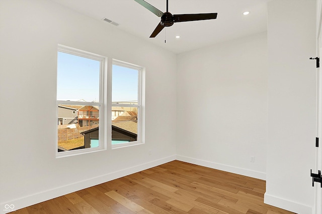 unfurnished room featuring baseboards, ceiling fan, light wood-type flooring, and recessed lighting