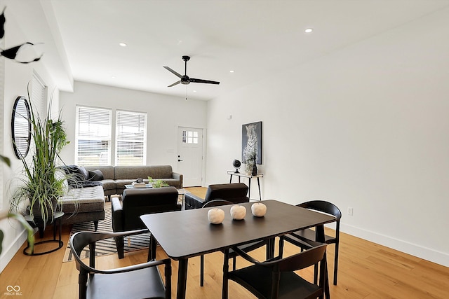 dining room featuring a ceiling fan, light wood-type flooring, baseboards, and recessed lighting