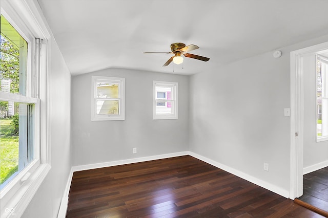 unfurnished room with dark wood finished floors, ceiling fan, lofted ceiling, baseboards, and a smoke detector