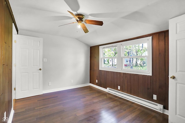 unfurnished room with baseboard heating, lofted ceiling, dark wood finished floors, ceiling fan, and baseboards