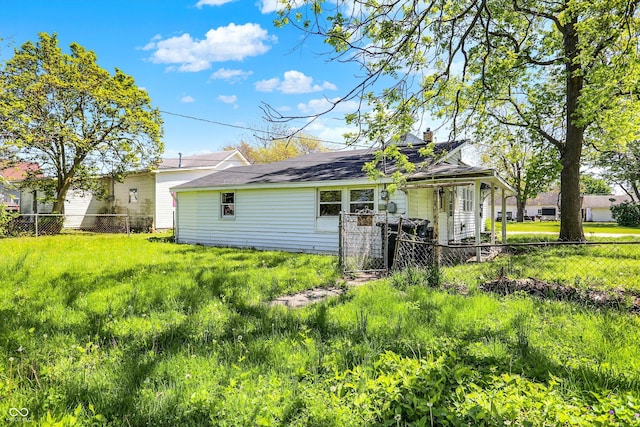 back of house featuring fence and a chimney
