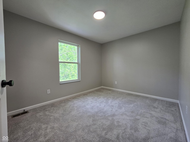 6369 Kelsey Dr, Indianapolis, IN 46268 - unfurnished room featuring carpet and baseboards