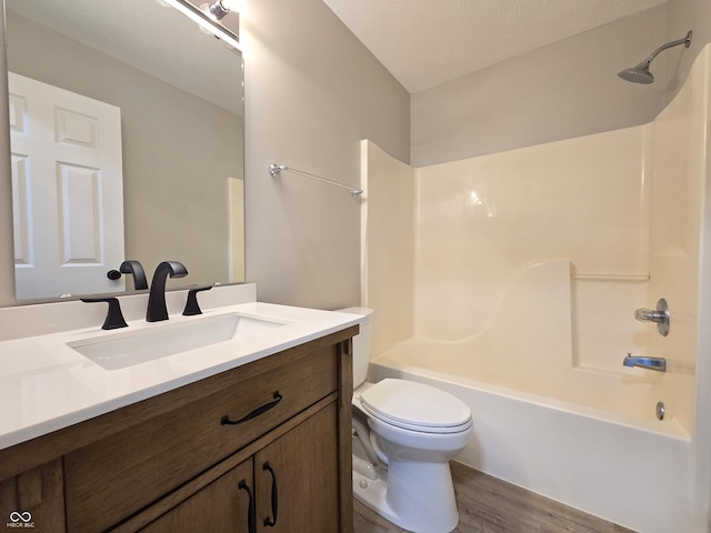 6369 Kelsey Dr, Indianapolis, IN 46268 - bathroom featuring wood finished floors, shower / tub combination, toilet, and vanity