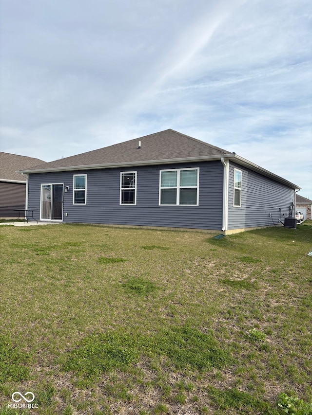 1380 Fairmount Dr, Greenfield, IN 46140 - rear view of house featuring a yard and central AC