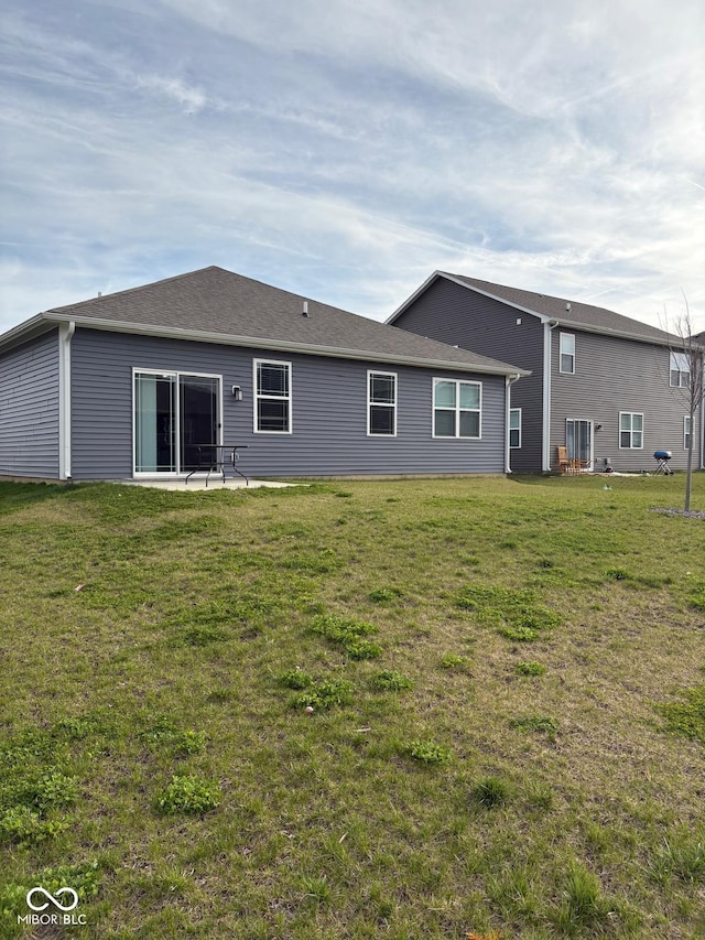 1380 Fairmount Dr, Greenfield, IN 46140 - rear view of house with a lawn