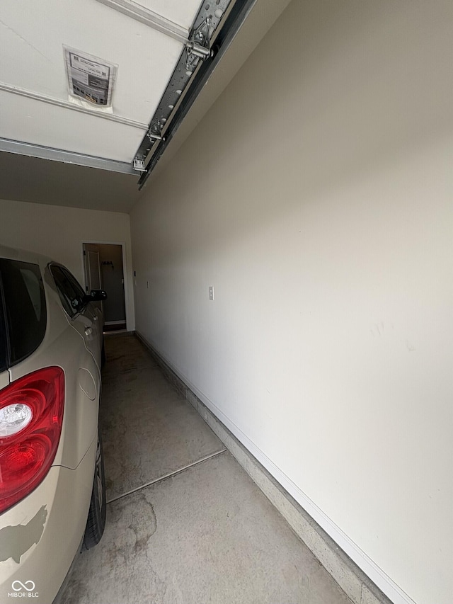 1380 Fairmount Dr, Greenfield, IN 46140 - garage featuring baseboards
