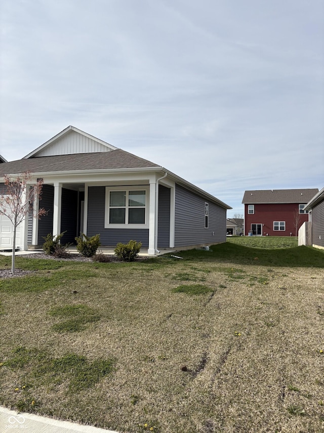1380 Fairmount Dr, Greenfield, IN 46140 - view of front facade with a garage, a front yard, and covered porch