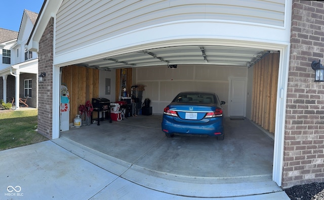 142 Winding Brook Way, Pendleton, IN 46064 - view of vehicle parking featuring a garage and concrete driveway