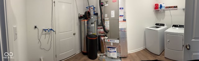 142 Winding Brook Way, Pendleton, IN 46064 - laundry room with separate washer and dryer and light wood-type flooring