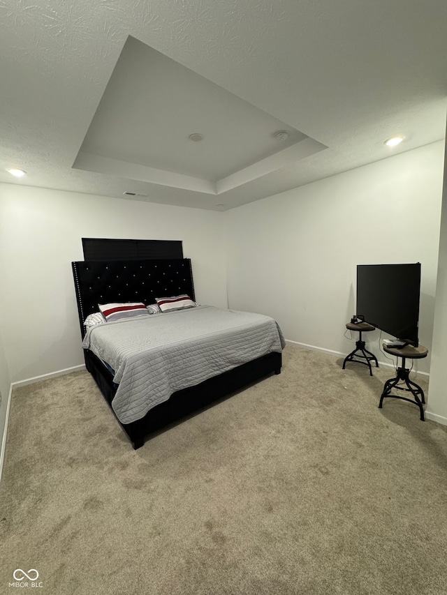 142 Winding Brook Way, Pendleton, IN 46064 - carpeted bedroom with a tray ceiling and baseboards