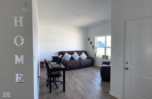 142 Winding Brook Way, Pendleton, IN 46064 - living area featuring wood finished floors and baseboards