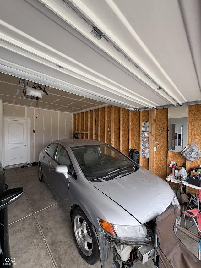 10931 N Longbranch St, Monrovia, IN 46157 - garage with electric panel and a garage door opener