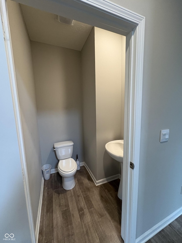 10931 N Longbranch St, Monrovia, IN 46157 - half bath with wood finished floors, toilet, and baseboards