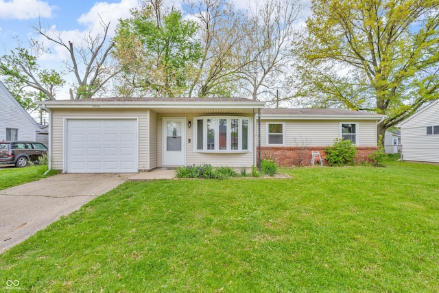 single story home with concrete driveway, an attached garage, a front yard, and brick siding