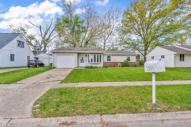 view of front of property with a front lawn, a garage, and concrete driveway