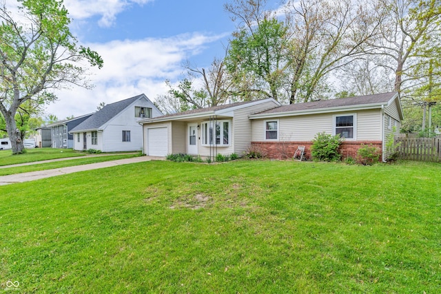 view of front of home with an attached garage, concrete driveway, and brick siding