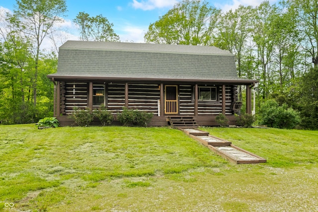 6968 S 300 W, Trafalgar, IN 46181 - view of front facade featuring log siding, a porch, a front lawn, and a shingled roof