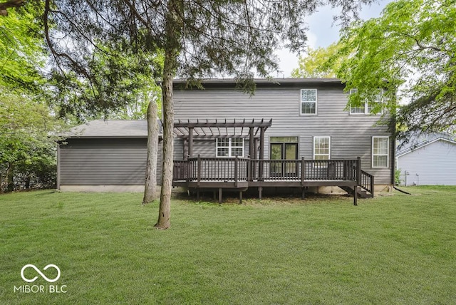 back of house with a pergola, a wooden deck, and a lawn
