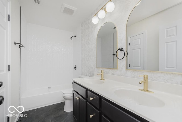 full bath with toilet, double vanity, and tub / shower combination
