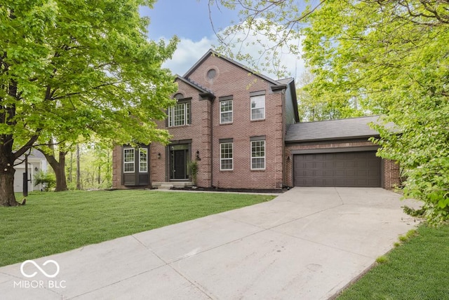 view of front facade featuring concrete driveway, an attached garage, a front lawn, and brick siding